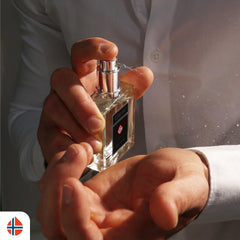 Geir Ness Eau de Parfum bottle on neck during application for a cool, clean scent