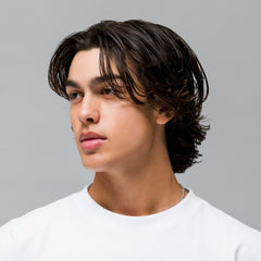 JOHNNY B. Conditional Conditioner on shelf suggesting thicker-looking hair after use.