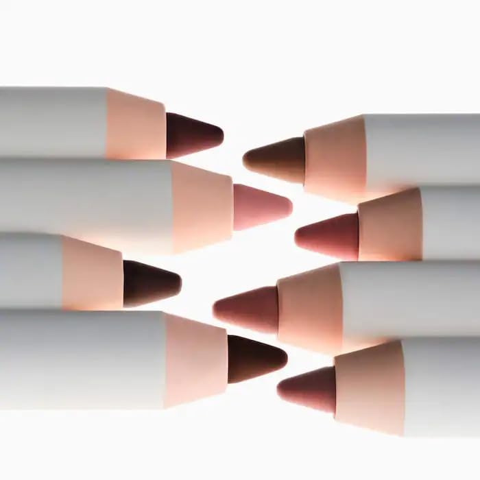Glossier Lip Liner Bare swatch on skin demonstrates buildable color and smooth application.