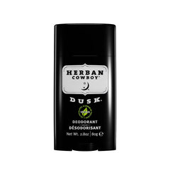 Herban Cowboy DUSK deodorant on an ambient background highlighting scent