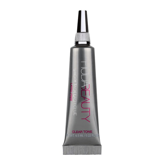 HUDA Beauty Sticky Tack Lash Glue bottle showing waterproof adhesion for all-day wear.