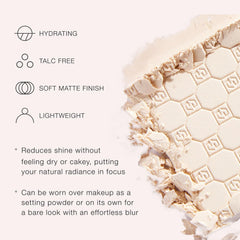 Jouer compact powder closeup shows smooth texture and blur effect.