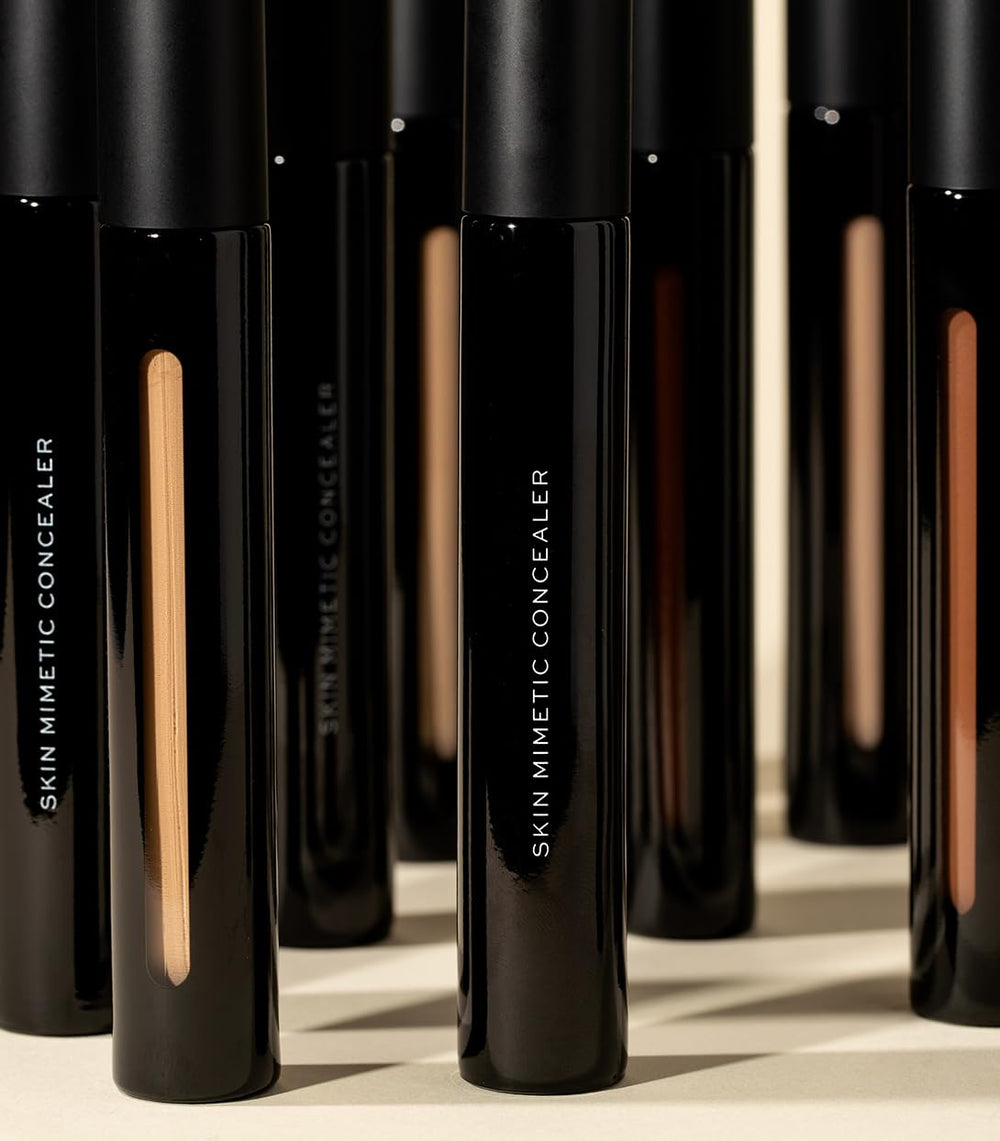 Face after application with MAKE Skin Mimetic Concealer for radiance.